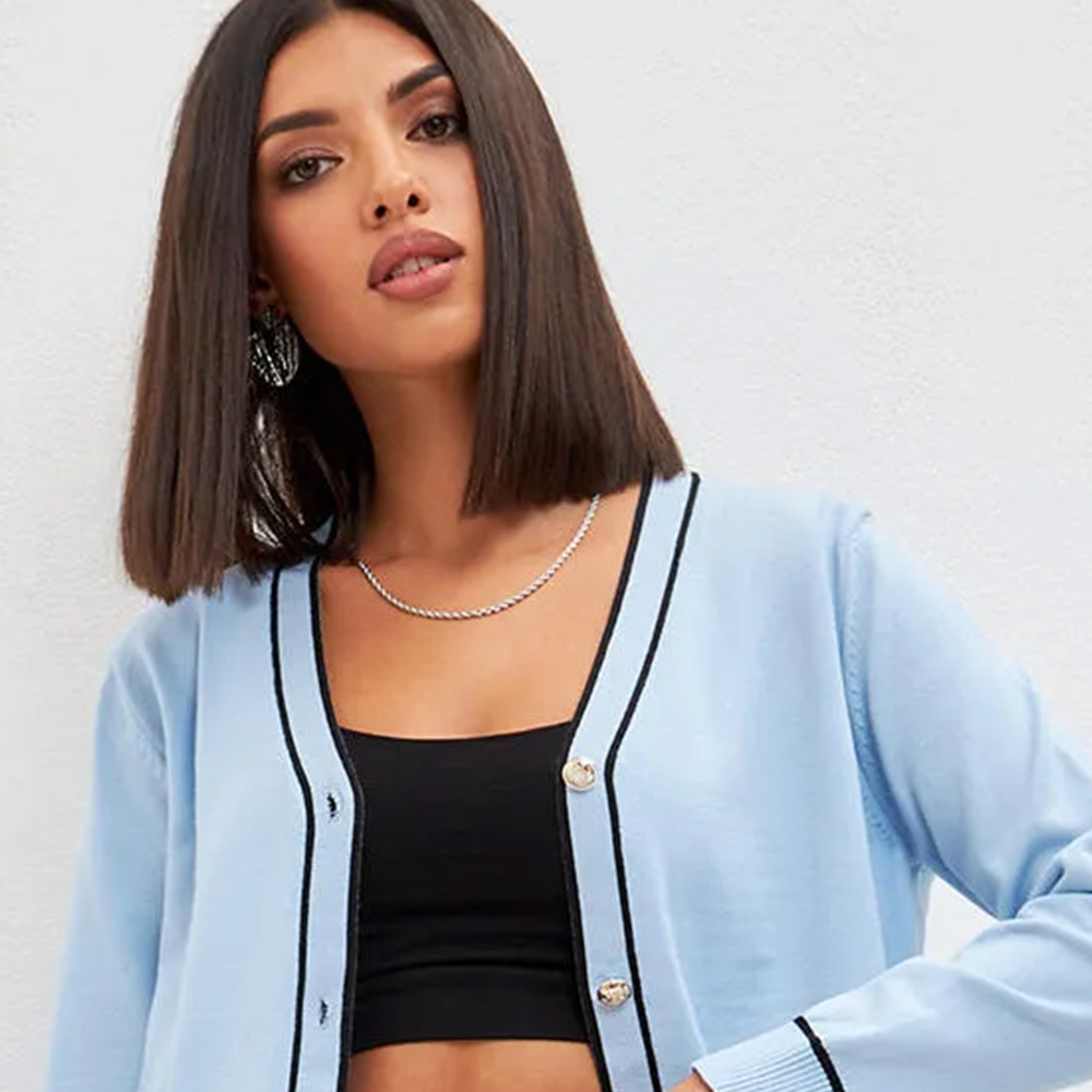 Woman in blue cardigan